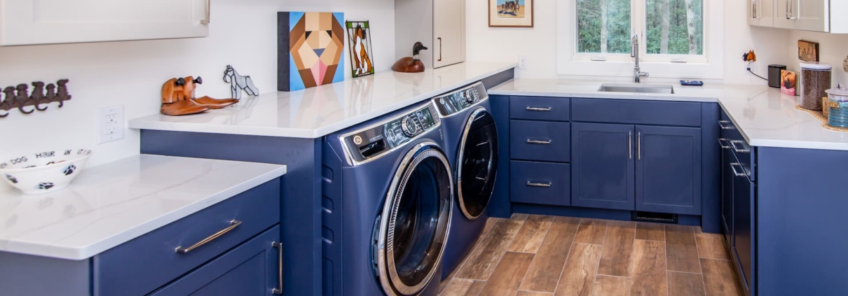 blue laundry room with windows
