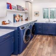 blue laundry room with windows