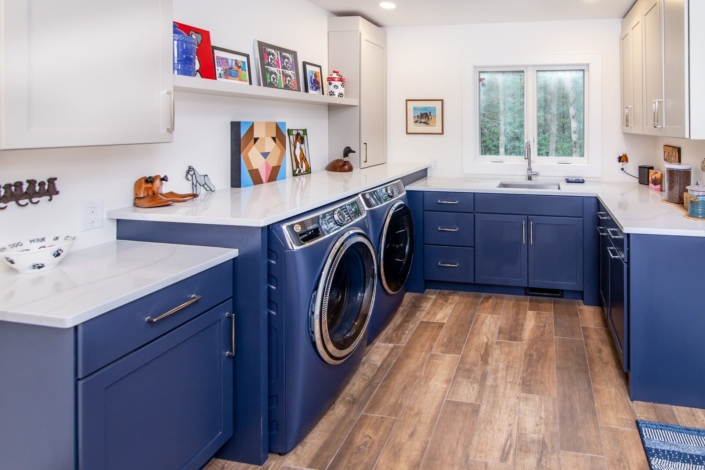 blue laundry room with windows
