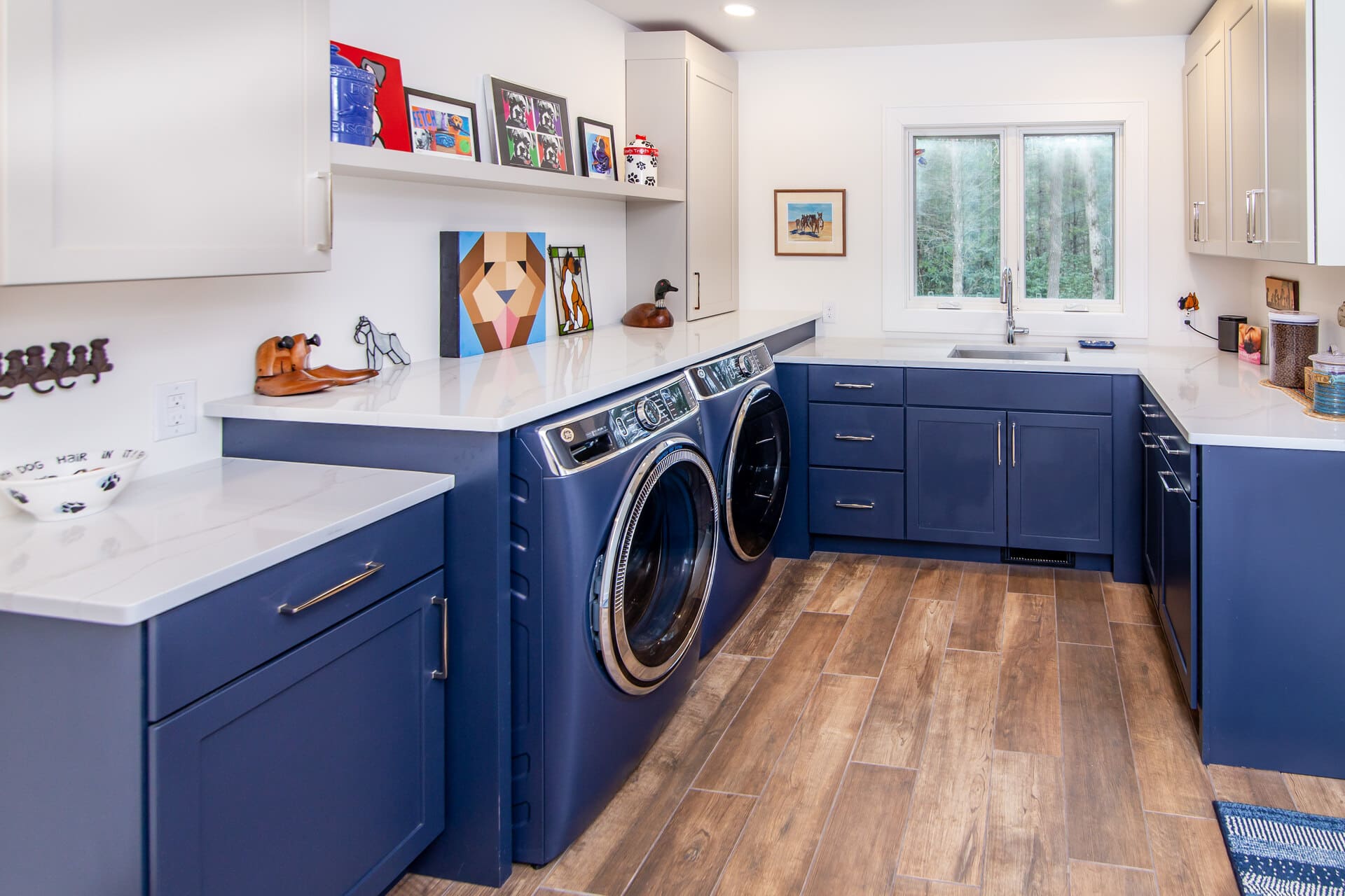 blue laundry room with windows