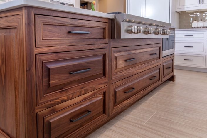 walnut island with a stovetop