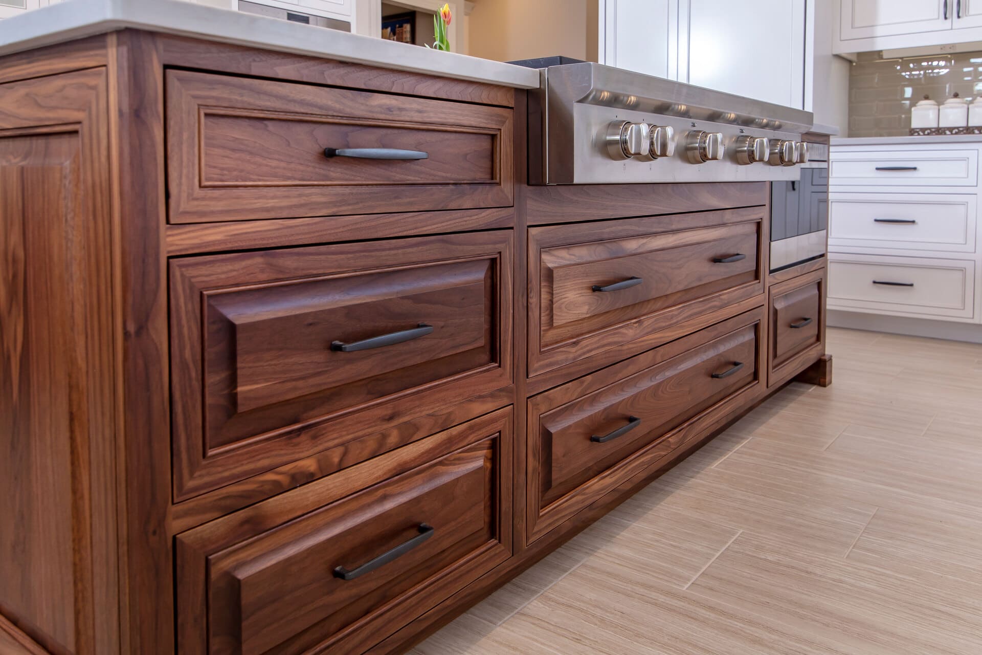 walnut island with a stovetop