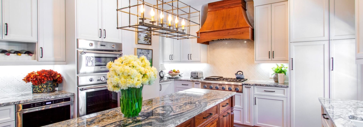 white kitchen with a walnut hood