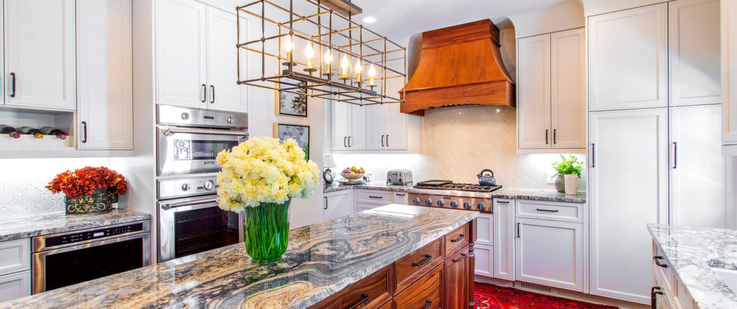 white kitchen with a walnut hood
