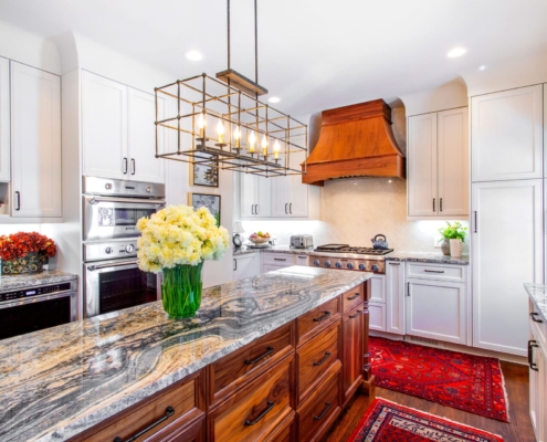 white kitchen with a walnut hood