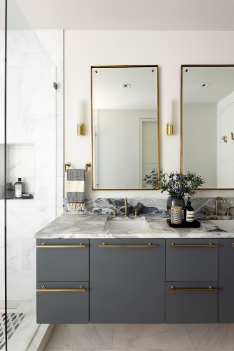 blue vanity with a walk in shower