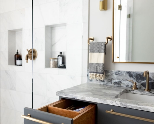 bathroom vanity and glass walk in shower