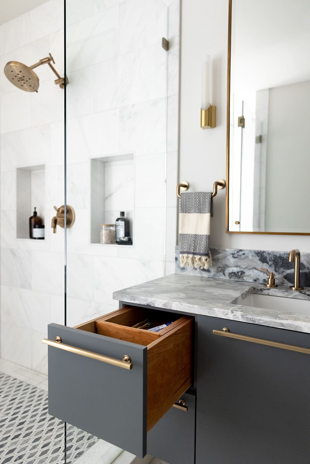 bathroom vanity and glass walk in shower