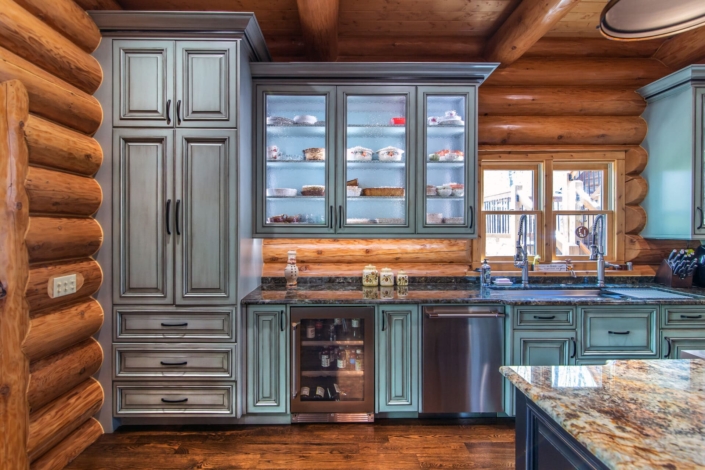 green kitchen with lighting