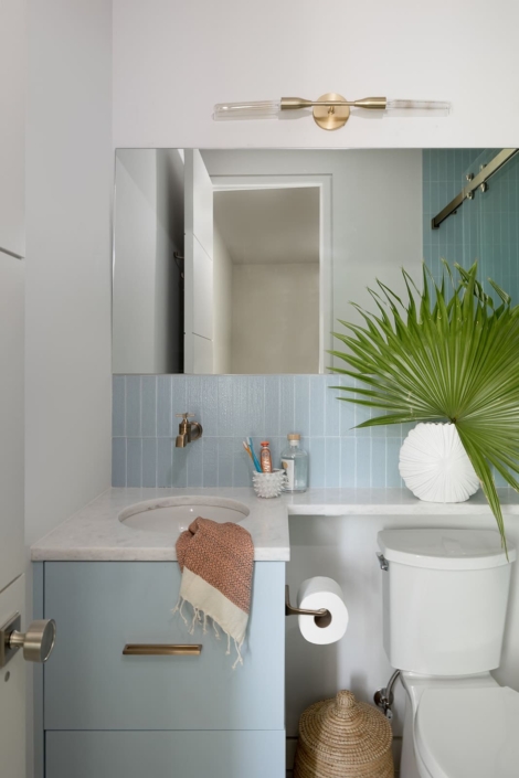 blue bathroom with gold accents