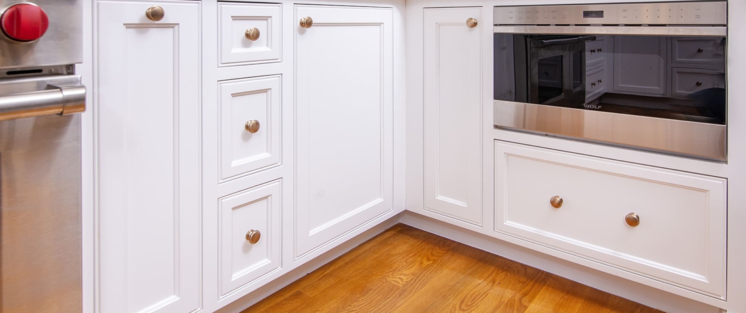 White cabinets with a drawer microwave