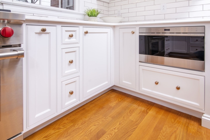 White cabinets with a drawer microwave