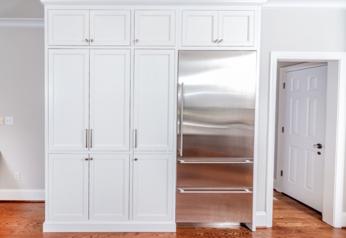 white kitchen and a fridge
