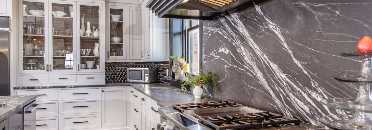 white kitchen with marble backsplash