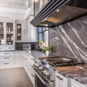 white kitchen with marble backsplash