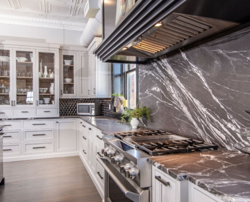 white kitchen with marble backsplash