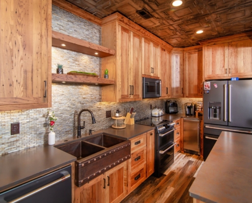 chesnut kitchen cabinets in pool house