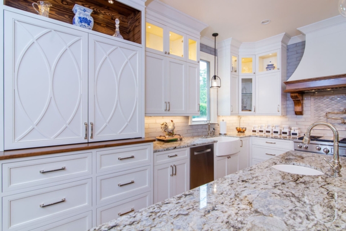 white kitchen with mullion cabinet doors