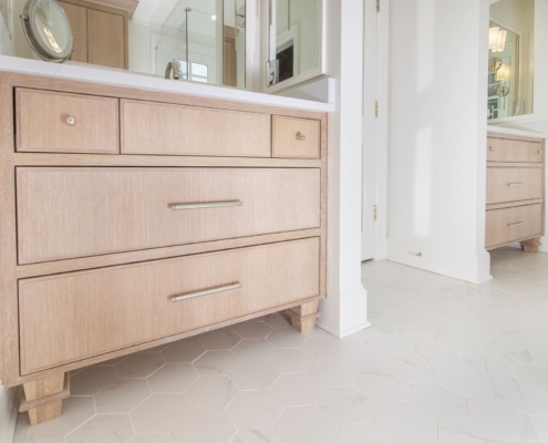 bathroom vanity with tile flooring
