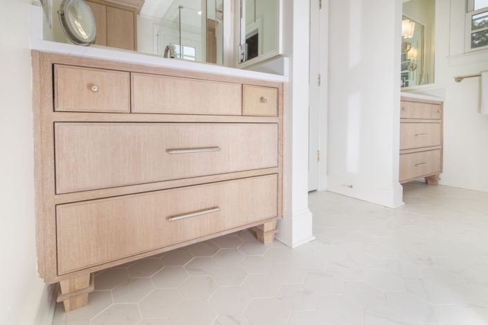 bathroom vanity with tile flooring