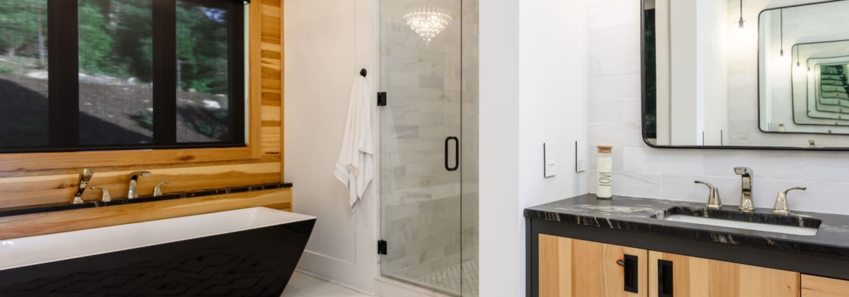 bathroom with a large tub and walk in shower