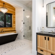 bathroom with a large tub and walk in shower