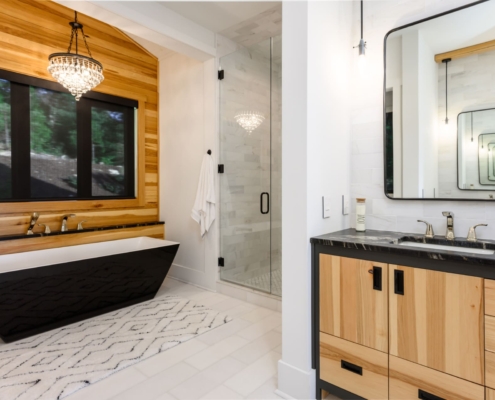 bathroom with a large tub and walk in shower