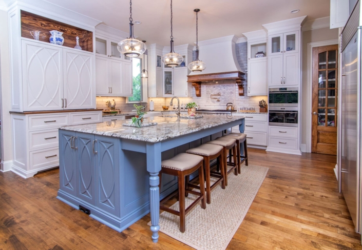 white kitchen with blue island