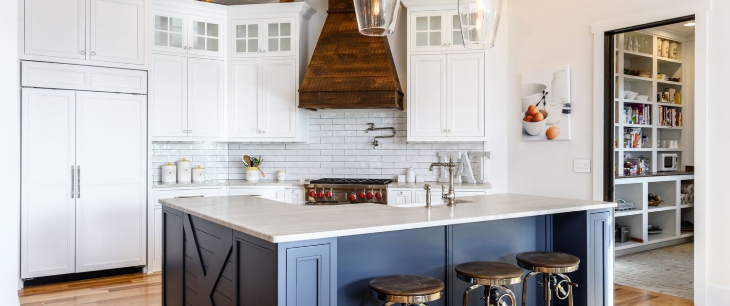 white and blue kitchen with a walk in pantry