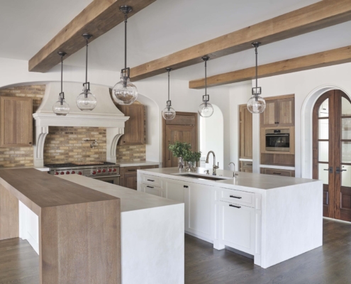 white and brown kitchen with doors