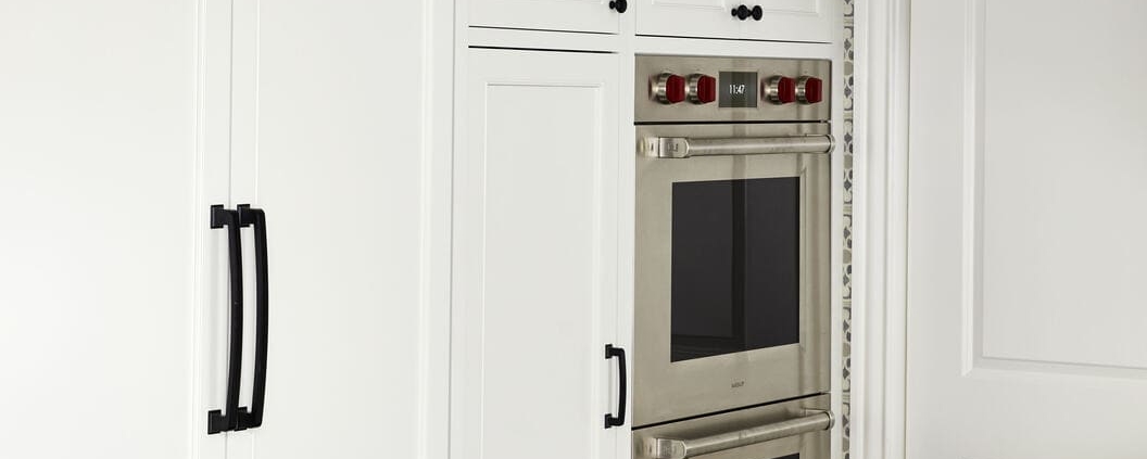 white kitchen with panel appliances