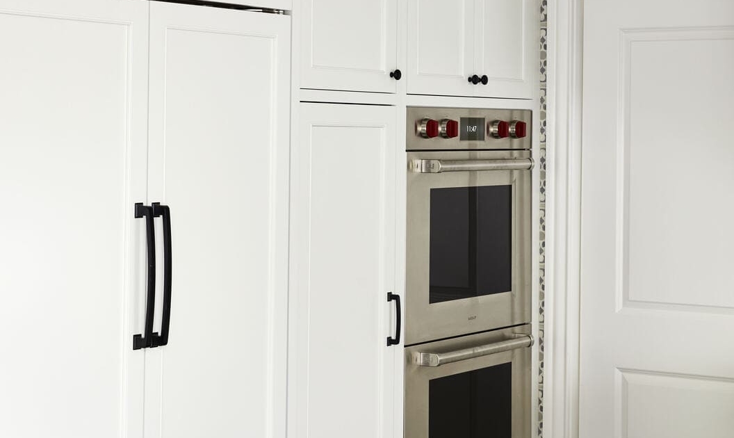 white kitchen with panel appliances