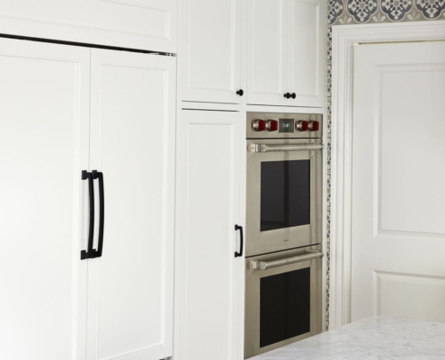 white kitchen with panel appliances