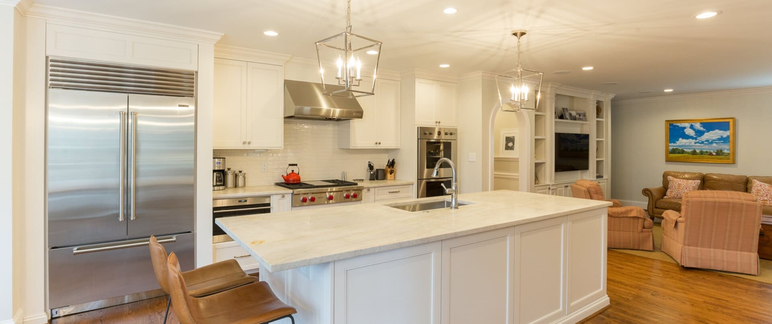 white kitchen and a timless living room