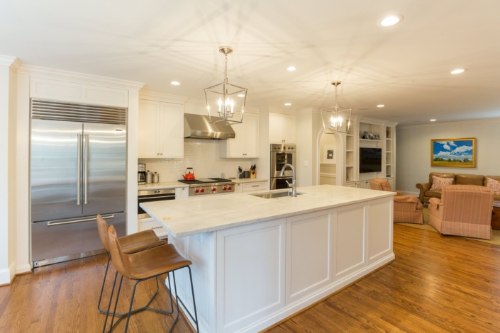 white kitchen and a timless living room