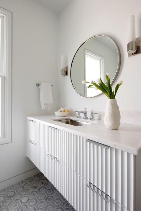 white floating vanity with flowers