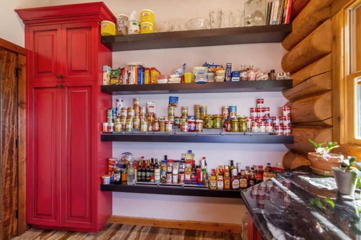 red pantry in a log cabin