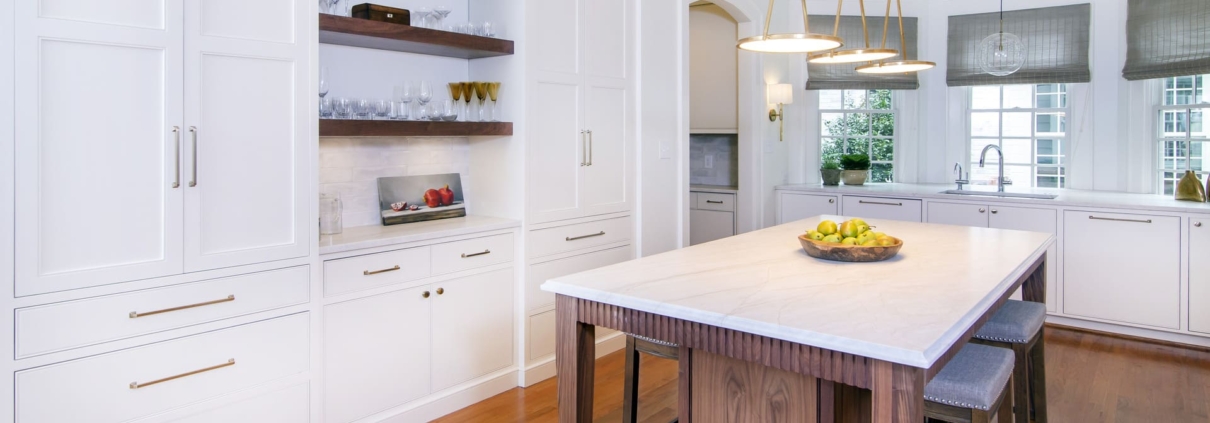 white kitchen with an archway entrance