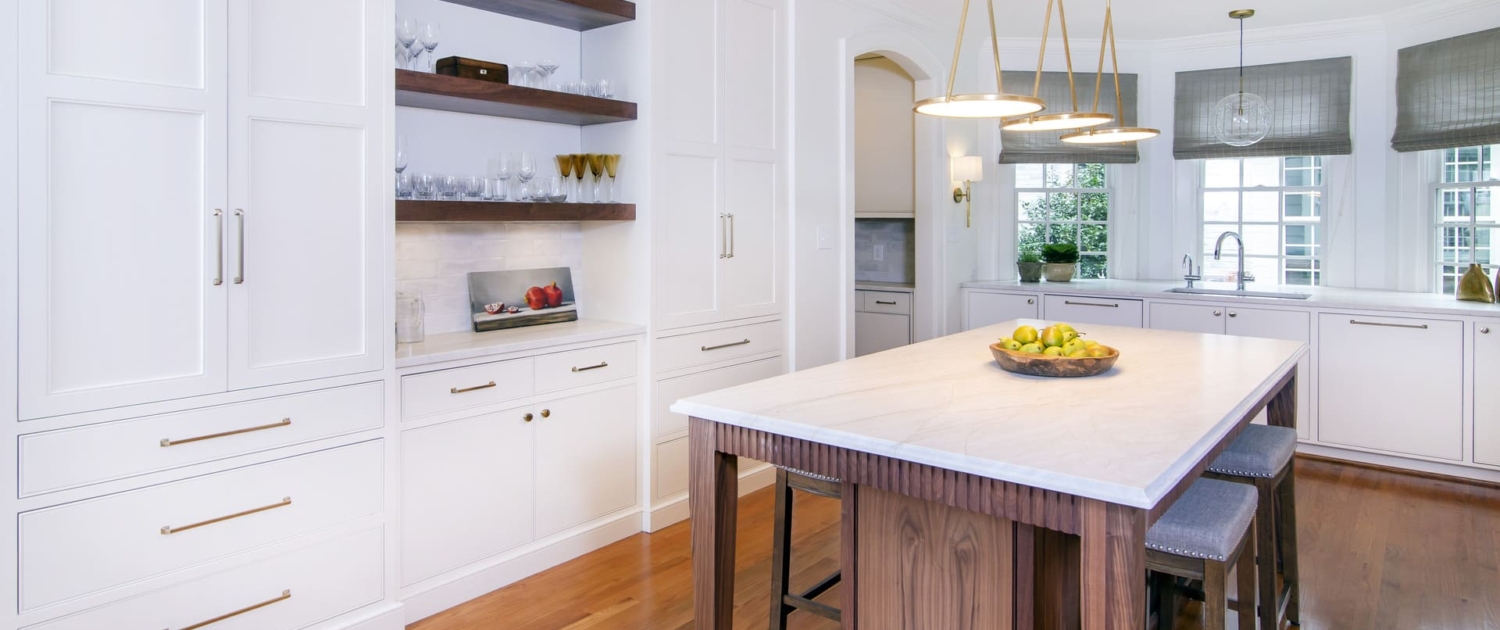 white kitchen with an archway entrance