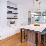 white kitchen with an archway entrance