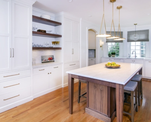 white kitchen with an archway entrance