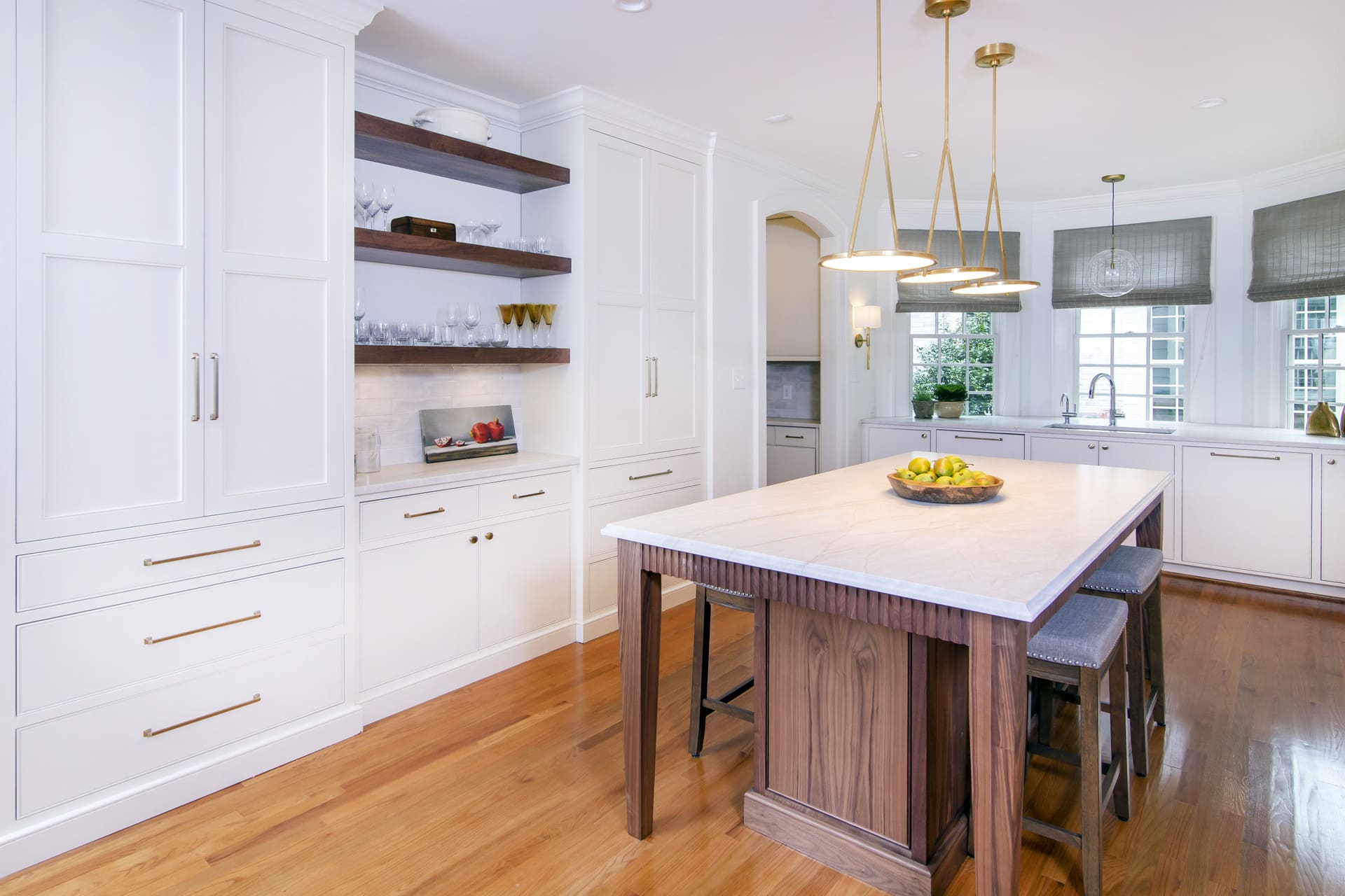 white kitchen with an archway entrance