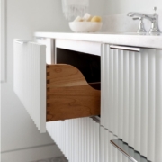 white vanity with a fluted drawer