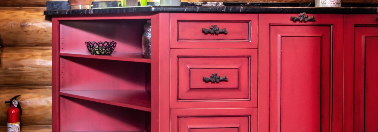 red cabinets in a log cabin