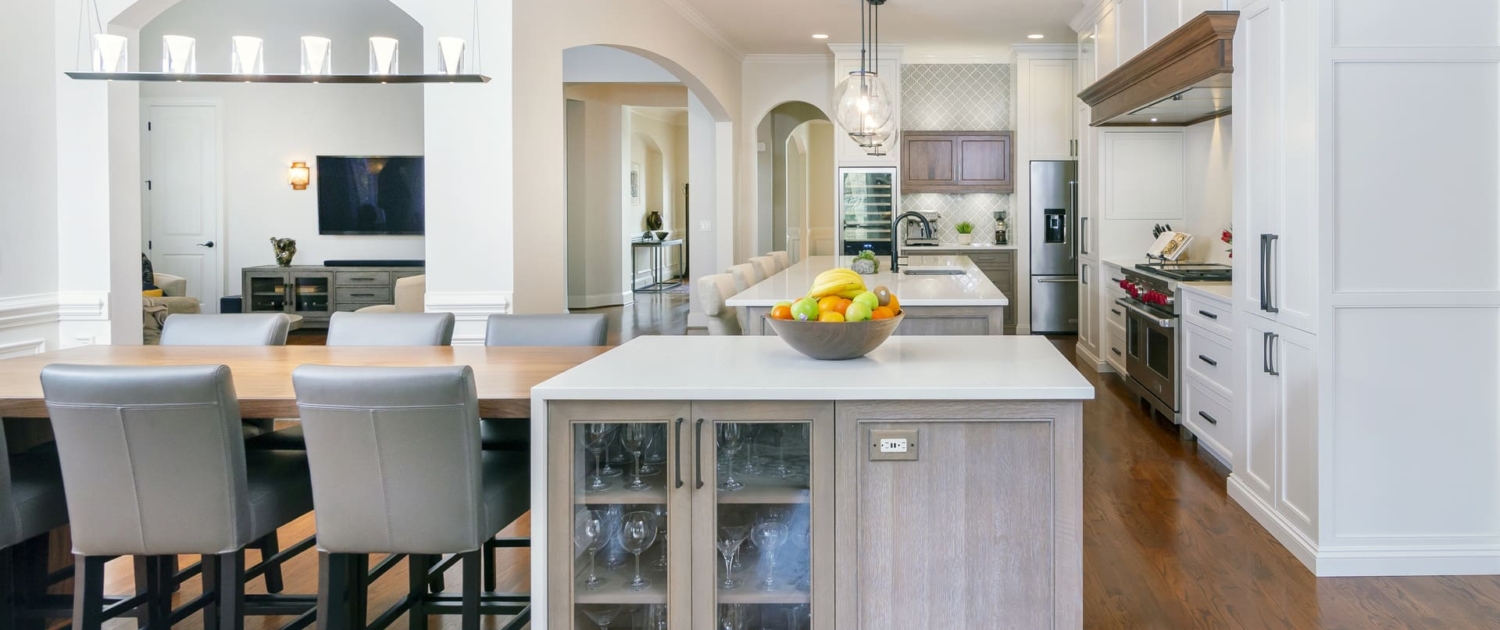 big white kitchen with a dining area