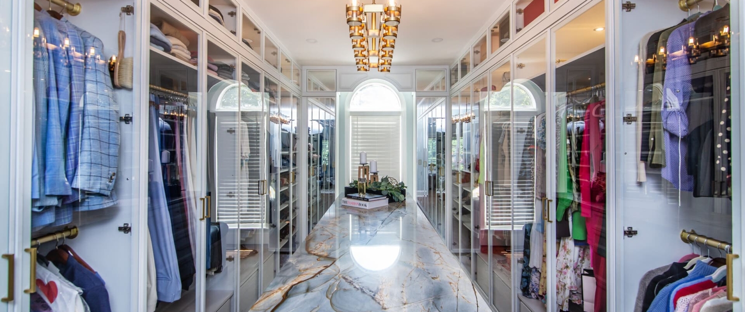 Custom closet with a large light fixture