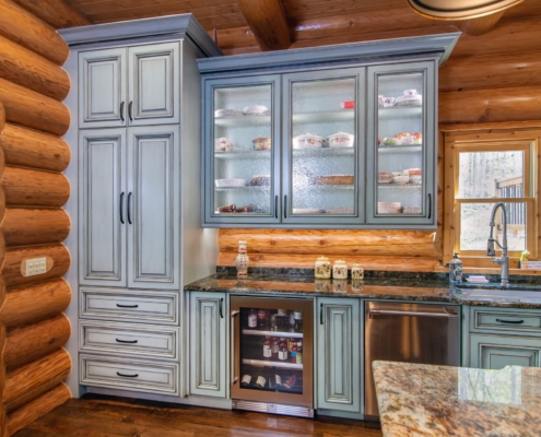 green cabinets with glass doors