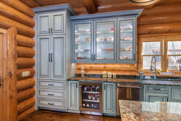 green cabinets with glass doors