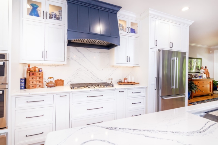 white kitchen with a blue hood