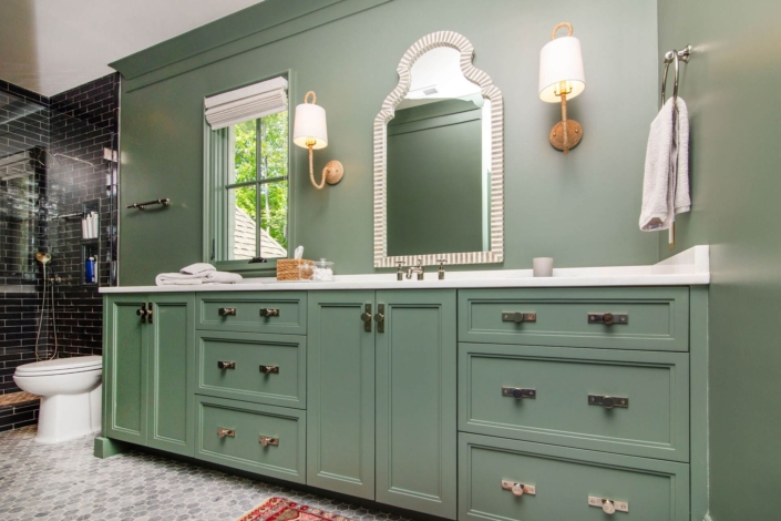 green bathroom vanity and light fixtures